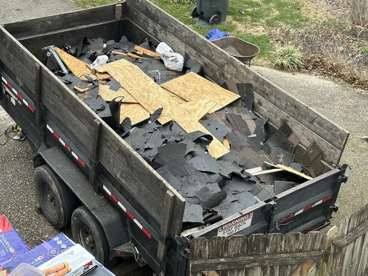 Old roofing debris hauled away in our trailer
